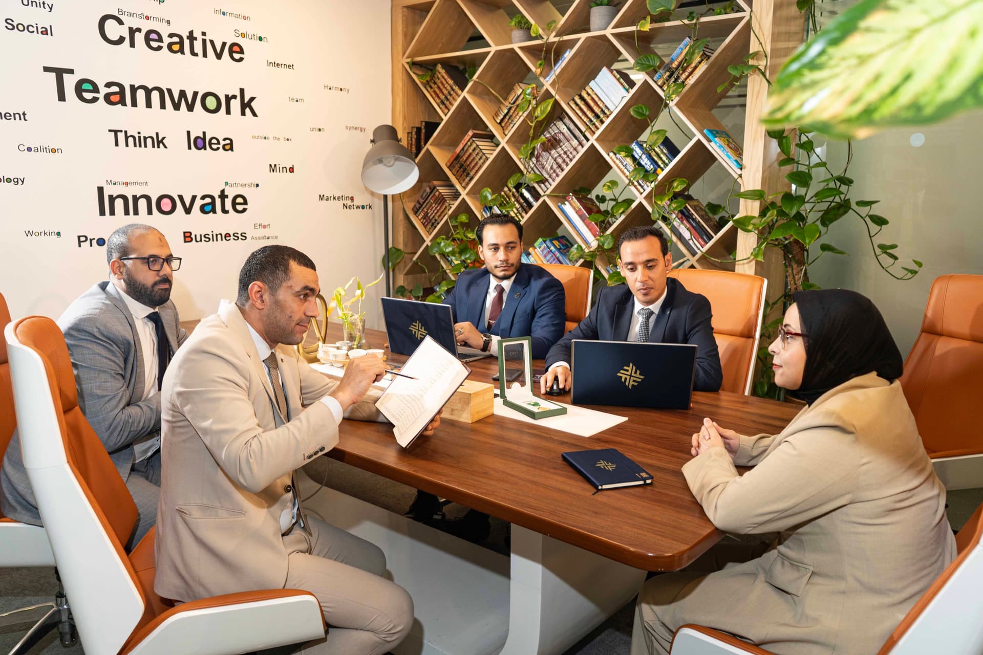 The team setting priorities around the boardroom table